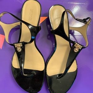 Size 9 1/2 Womens Michael Kors sandals. Been worn, needs love.